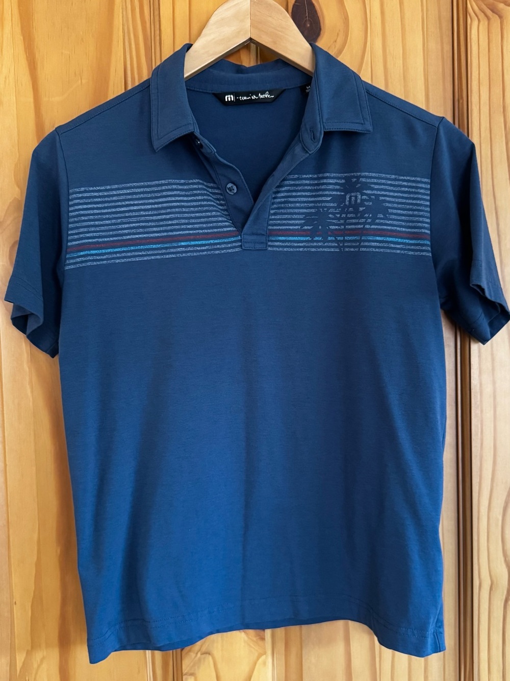 Travis Mathew Navy Polo with Subtle Stripe Detail